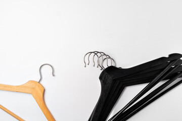 a pile clothes hangers on isolated white background