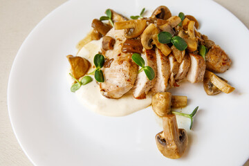 Turkey and mushroom dish with bechamel sauce.