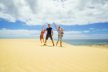 A happy young family in fuerteventura. Fun with the family photo on vacation.