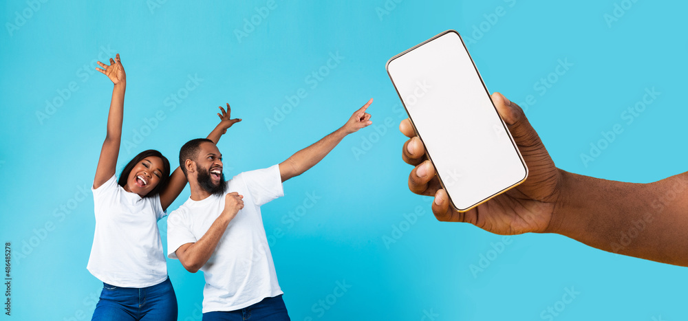 Poster black couple showing blank empty smartphone screen for mockup