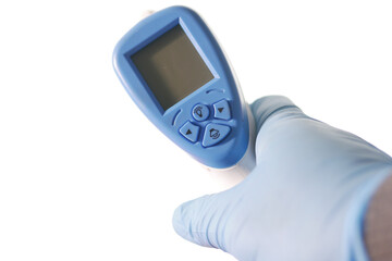 Hand holding infrared thermometer to measuring temperature.