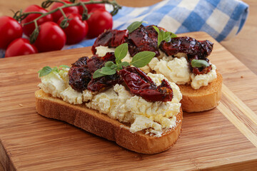 Bruschetta with soft cheese and tomato