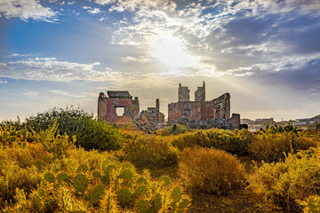 ruined castle in the canary islands in ruins with beautiful colors ruins of a bygone era of the canary islands with red colors known as the tojo de jinamar castle with ancient architecture