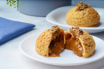 Delicious chocolate cake on plate on table on light background