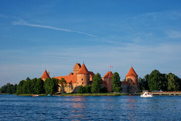 Naklejka na ściany i meble Trakai Island Castle in lake Galve with boats and yachts in summer day with beautiful sky, Lithuania. Trakai Castle is one of major tourist attractions of Lituania