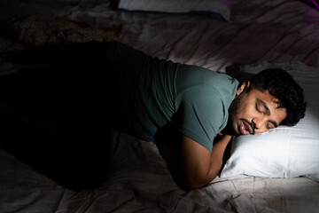 young man having nice comfortable sleep at time - concept of healthy lifestyle, relaxation and taking nap