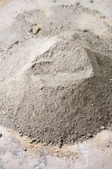 pile of cement and sand mixer, ready to make cement mortar, home improvement, construction and masonry work concept