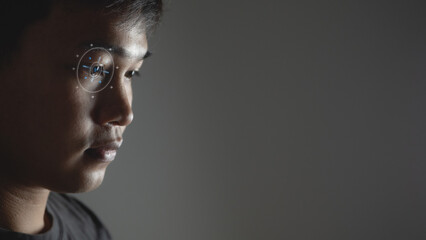 Eye scaning technology in ophthalmology concept. Vision test. Low key photo. Side view.