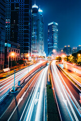 the light trails on the modern building background in shanghai china.