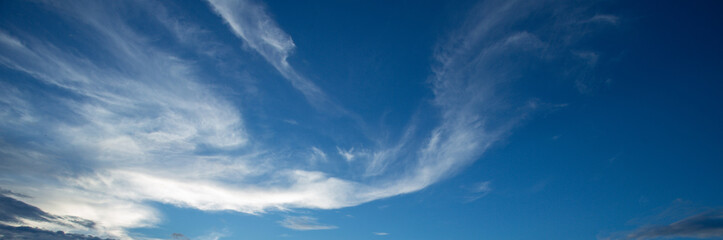 blue sky background with tiny clouds