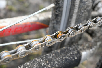 bicycle chain covered with rust. link of a bicycle chain. bike care. cycling in bad weather.