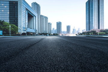 Fototapeta premium Asphalt road High way Empty curved road clouds and sky at sunset