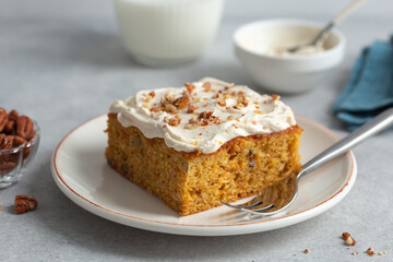 carrot cake with nuts and  cream cheese frosting - 486496670