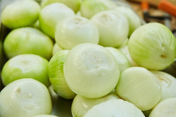 The product is raw peeled onions with a large amount for cooking.