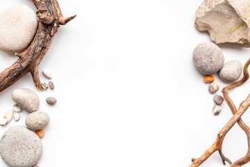 Frame of natural mineral rocks with snag tree branch