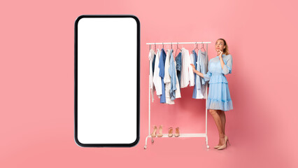 Woman Standing Near Cellphone Screen Shopping Online Choosing Clothes, Studio