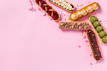 Cupcakes eclairs with pistachio raspberries and chocolate cream topping