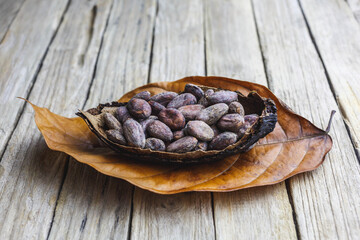 Dry  organic cocoa bean on wooden table