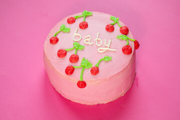Fototapeta na wymiar baby girl birthday cake on pink background