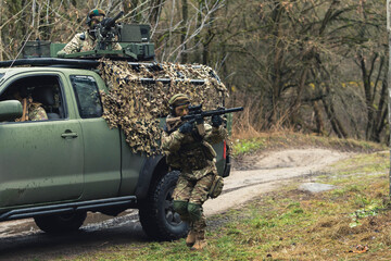 Combating bandits with fully armed rifles at battlefield High quality photo