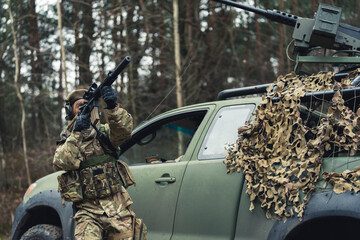 Ready up air firing in the jungle with backup. High quality photo