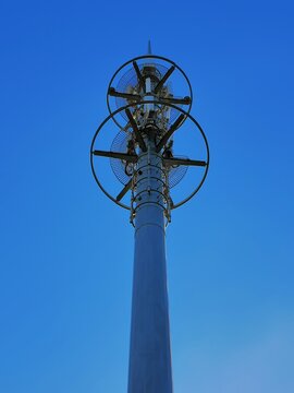 Large lightning rod tower against a blue sky background