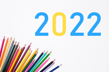 2022 school year with heap colored pencils isolated on white background. Banner. Creative development and education of preschoolers, children and adults. Art stationery shop card. Year color. Mockup.
