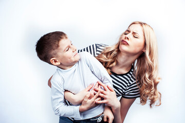 young modern blond mother with cute son together happy smiling family posing cheerful on white...