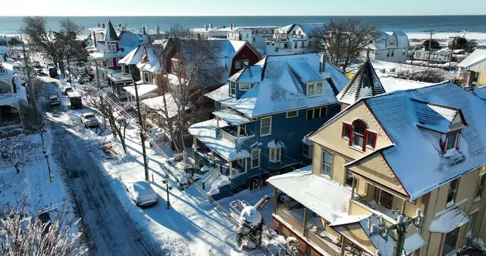 Seaside town in USA. Winter snowstorm. Cape May New Jersey Victorian architecture. Beach community. Blizzard clean up.