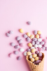 Easter composition with mini chocolate eggs in pastel colors