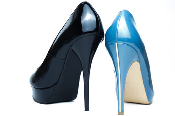 Sexy women's black and blue high-heeled shoes of different models. Isolated on a white background. The concept of choice.
