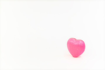 A pink heart on a white background, isolated
