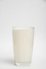 Milk glass closeup on white background
