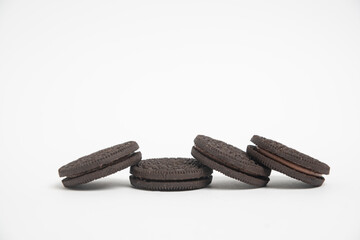 Chocolate cookies with cream filling isolated on white background.