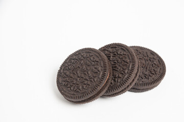 Chocolate cookies with cream filling isolated on white background.