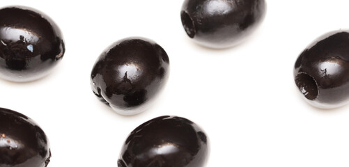 Black olives isolated on a white background.