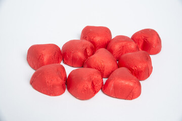 Chocolate red heart sweets for Valentine's Day on a white background