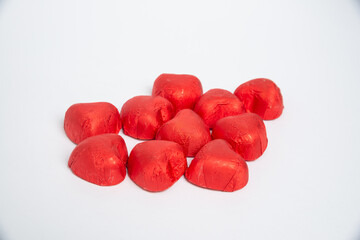 Chocolate red heart sweets for Valentine's Day on a white background