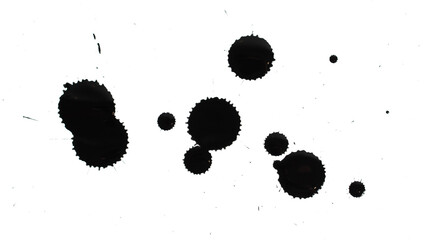 Drops of black paint on a white background.
