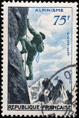 Mountain climbing celebration on vintage french stamp