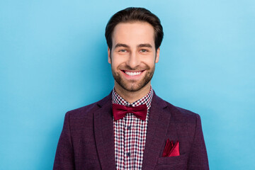 Portrait of handsome good looking showman mister husband in tuxedo visit event isolated on blue color background