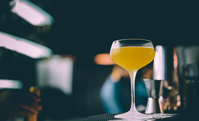 Refreshing French 75 Cocktail in glass on a Bar