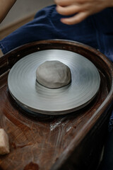 Fototapeta premium Clay on a potter's wheel