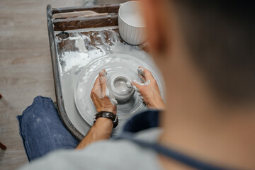 Modeling clay on a potter's wheel