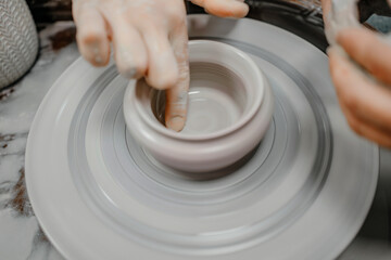 Modeling clay on a potter's wheel