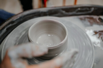 Modeling clay on a potter's wheel