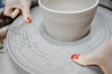 Modeling clay on a potter's wheel