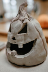 Pumpkin head sculpted from clay close-up