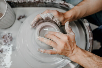 Modeling clay on a potter's wheel