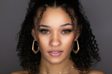 Glamour portrait of a stunning young black woman looking at camera